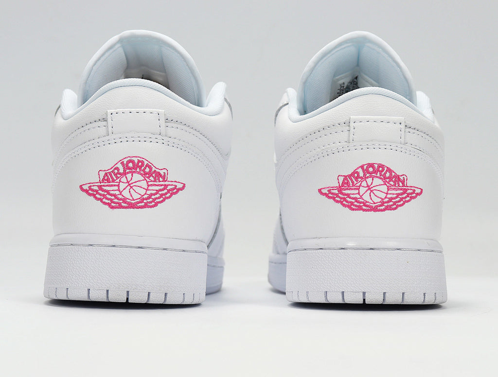 Air Jordan 1 Low White and Pink Sneakers - product image from the listing.