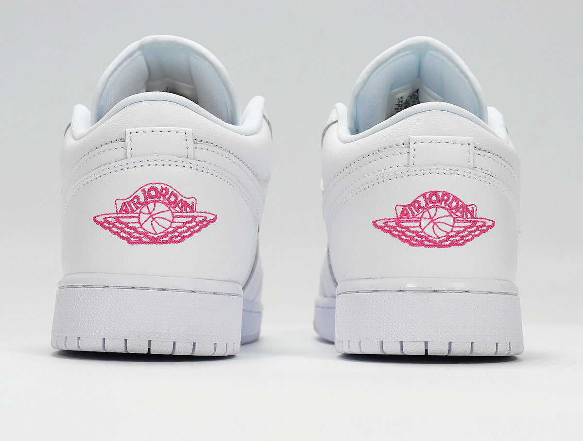 Air Jordan 1 Low White and Pink Sneakers - product image from the listing.