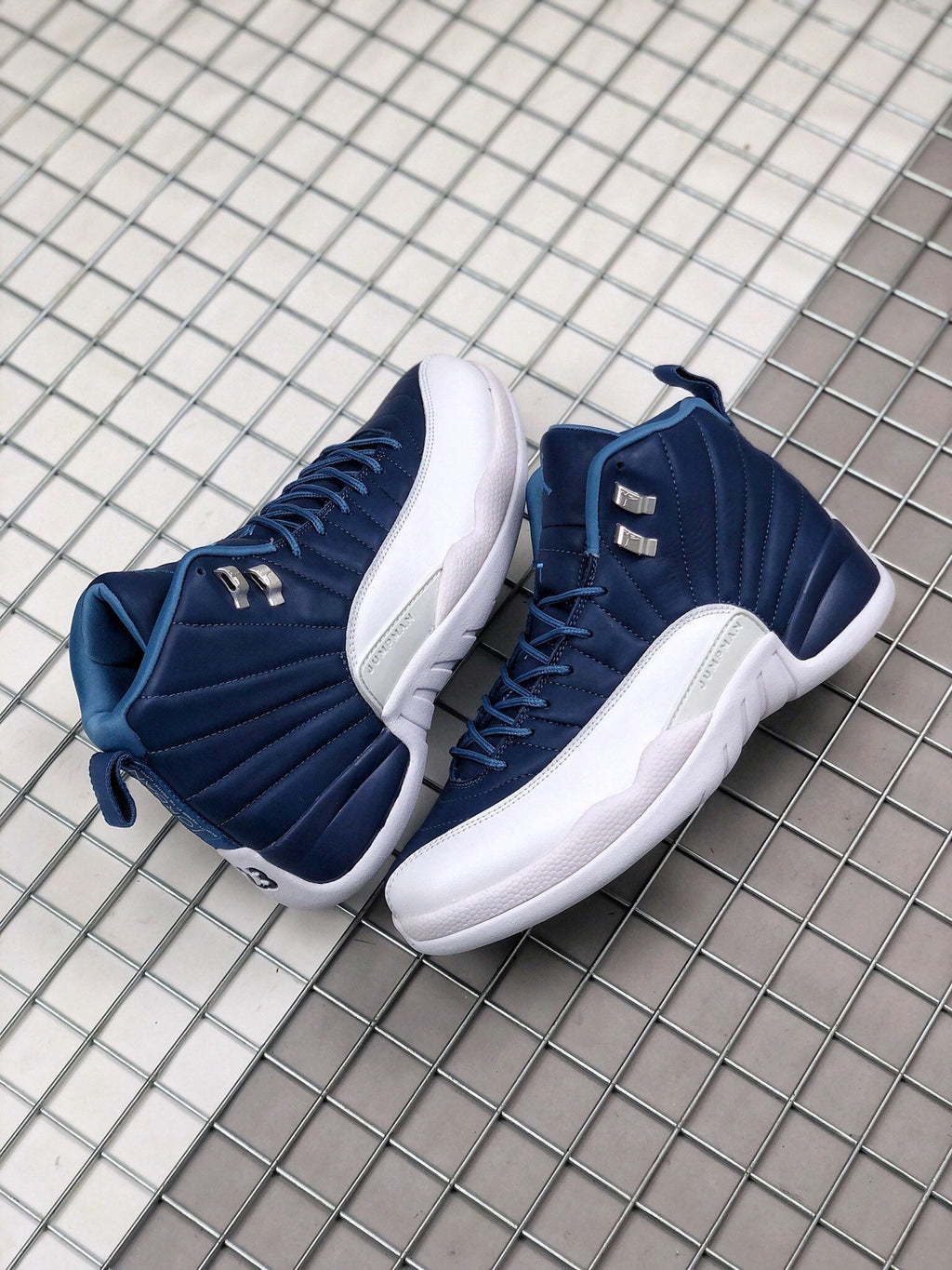 Air Jordan 12 Indigo Sneakers 130690-404 - product image from the listing.