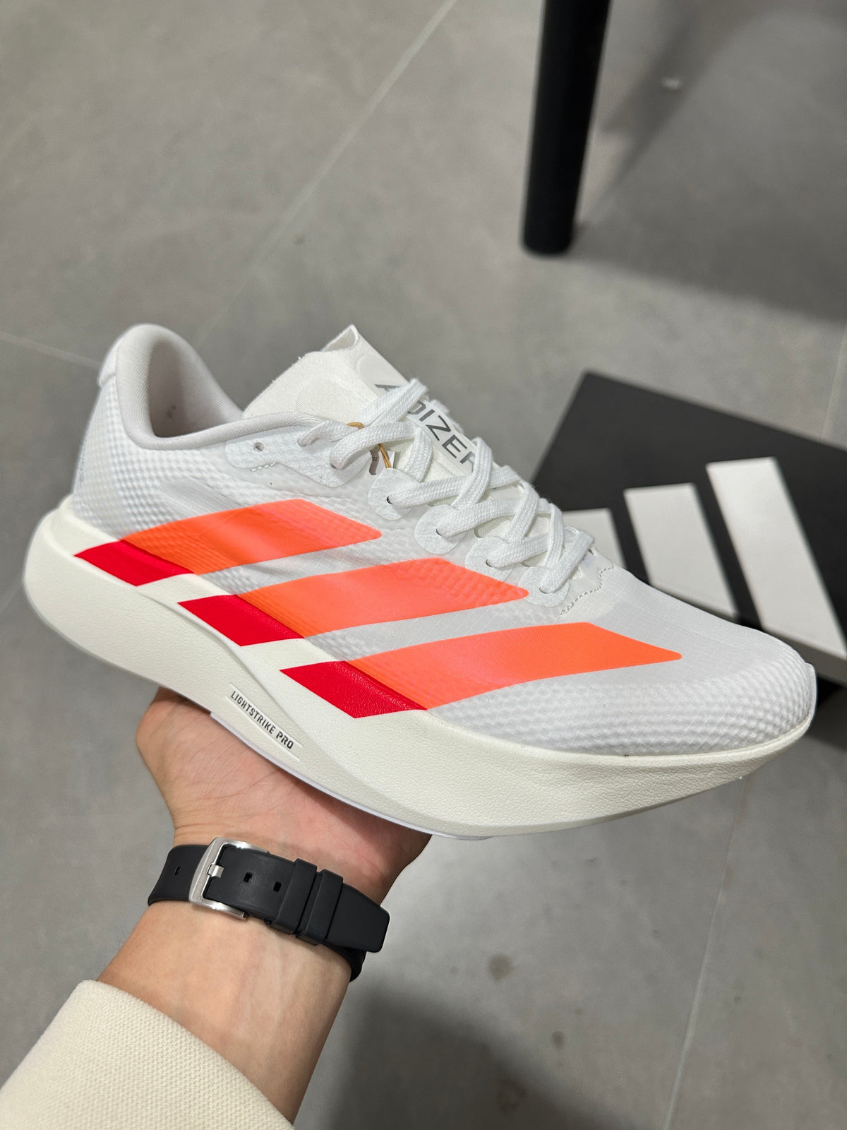 Adidas Adizero EVO SL Running Shoes in White Orange - product image from the listing.