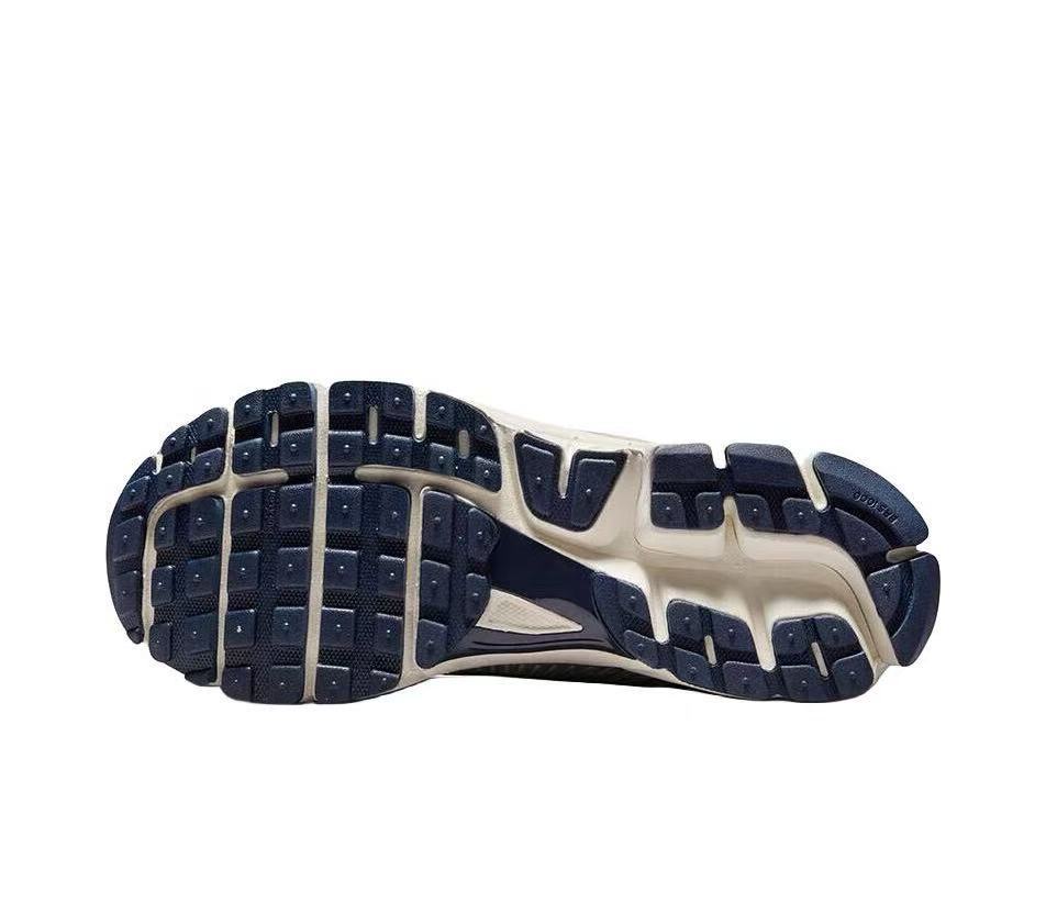 Nike Zoom Vomero 5 Sneakers in Gray Orange - product image from the listing.