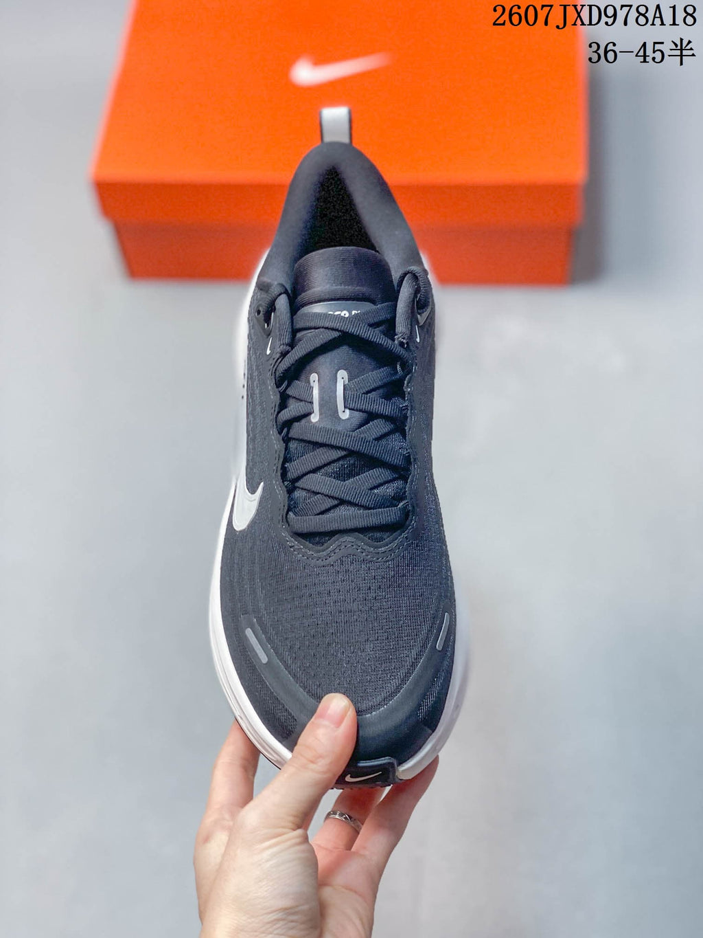 Nike Vomero Plus Running Sneakers in Dark Gray White 2607JXD978A18 - product image from the listing.