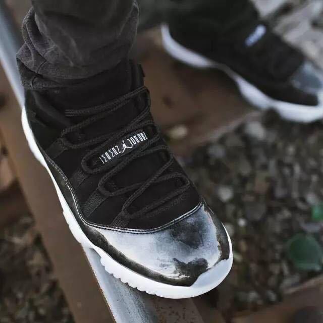 Jordan 11 Retro Low Barons Sneakers in Black White - product image from the listing.