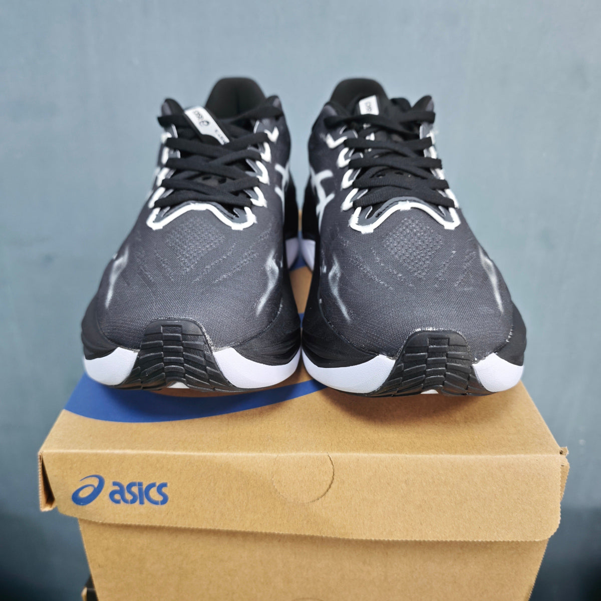 ASICS FF Leap Running Shoes in Black White 1013A177-100 - product image from the listing.