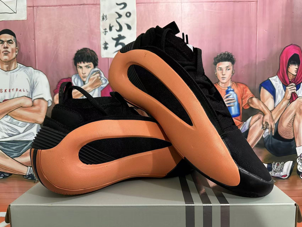 Basketball Sneakers in Black and Orange - product image from the listing.