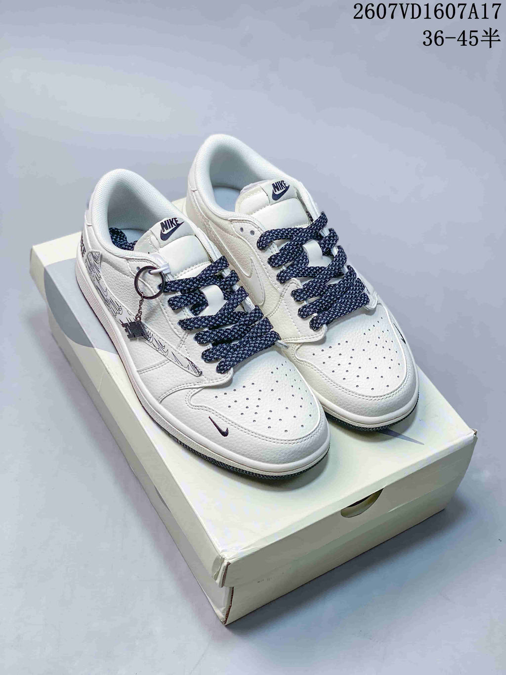 Travis Scott x Jordan 1 Low Sneakers in White Black 2607VD1607A17 - product image from the listing.