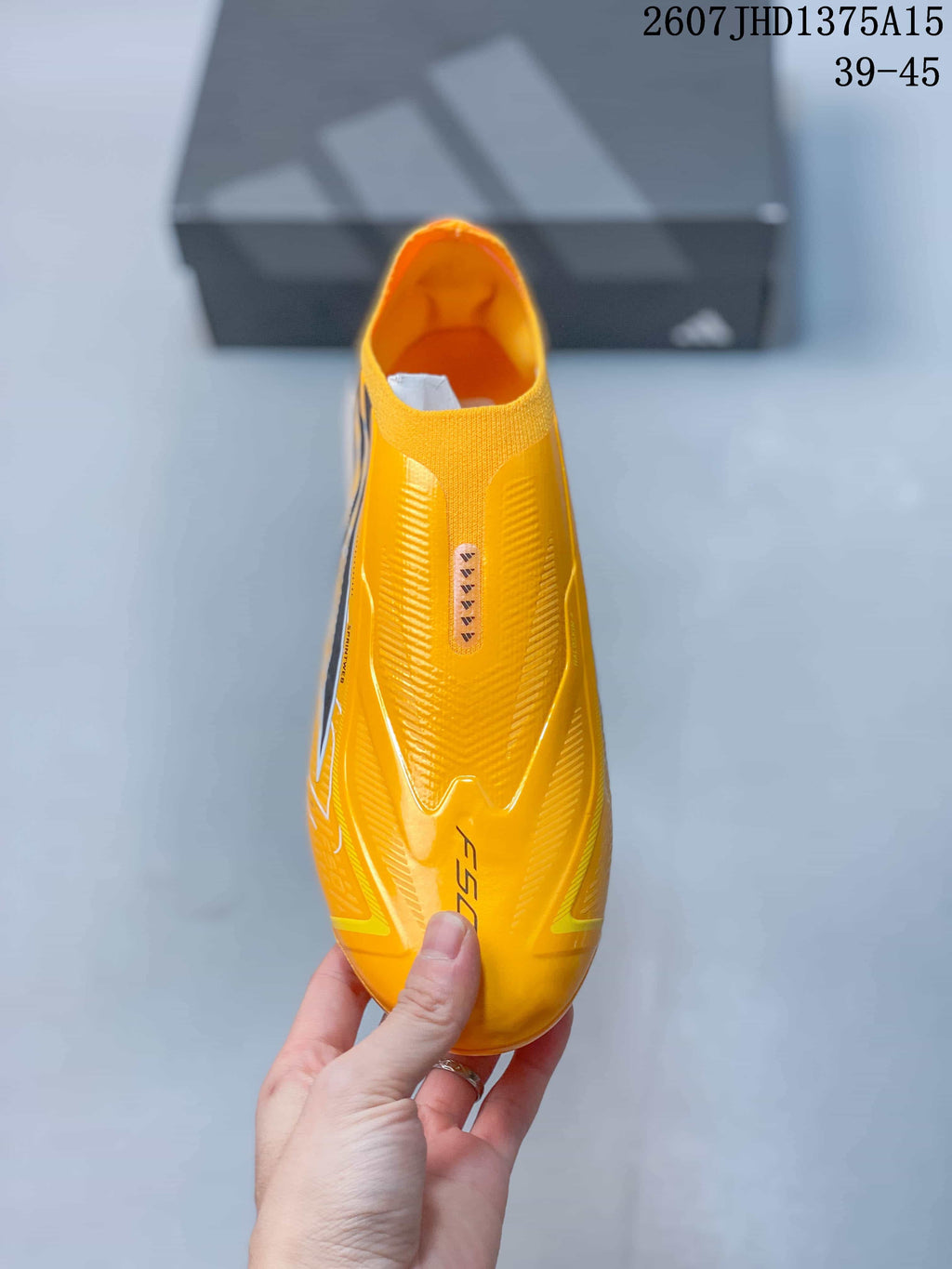 F50 Elite Yellow Black Laceless Soccer Cleats by adidas - product image from the listing.