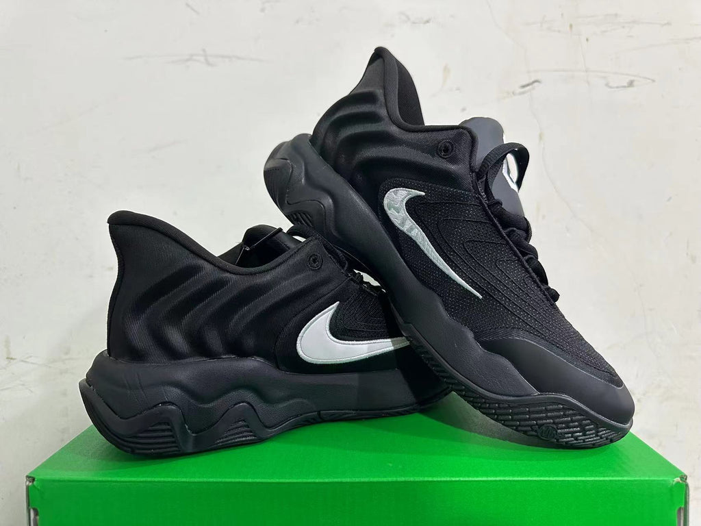 Nike Black Basketball Footwear with White Swoosh - product image from the listing.