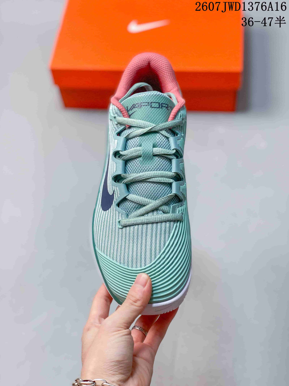 Mint Green and Coral Nike Vapor 12 Low-Top Tennis Sneakers - product image from the listing.