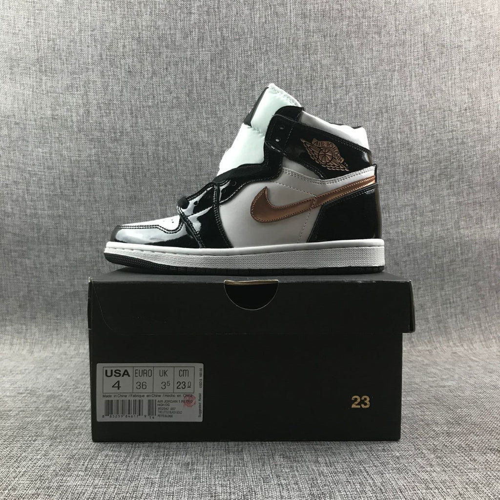 Air Jordan 1 Mid Sneakers in Black White Metallic Gold 852542-007 - product image from the listing.