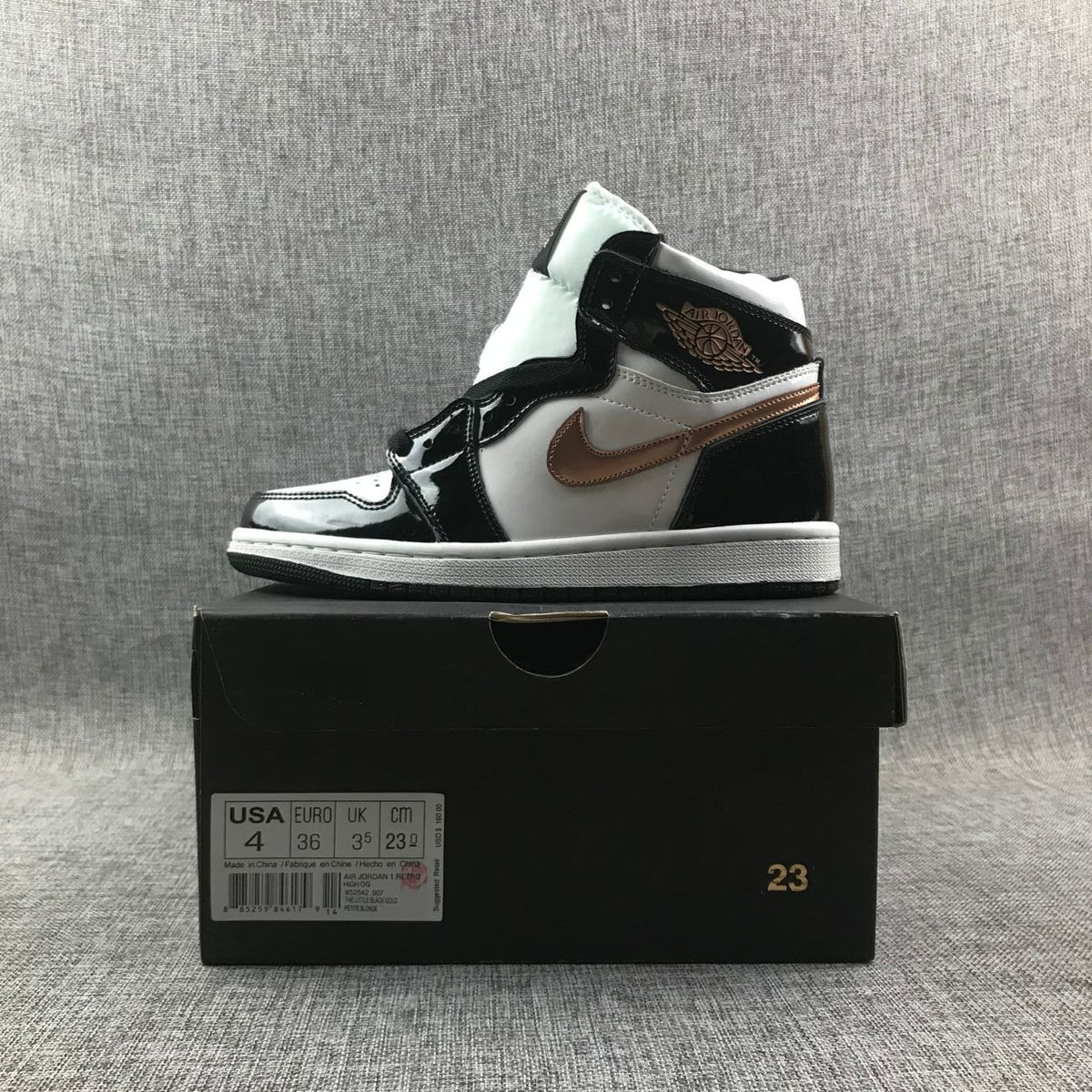 Air Jordan 1 Mid Sneakers in Black White Metallic Gold 852542-007 - product image from the listing.