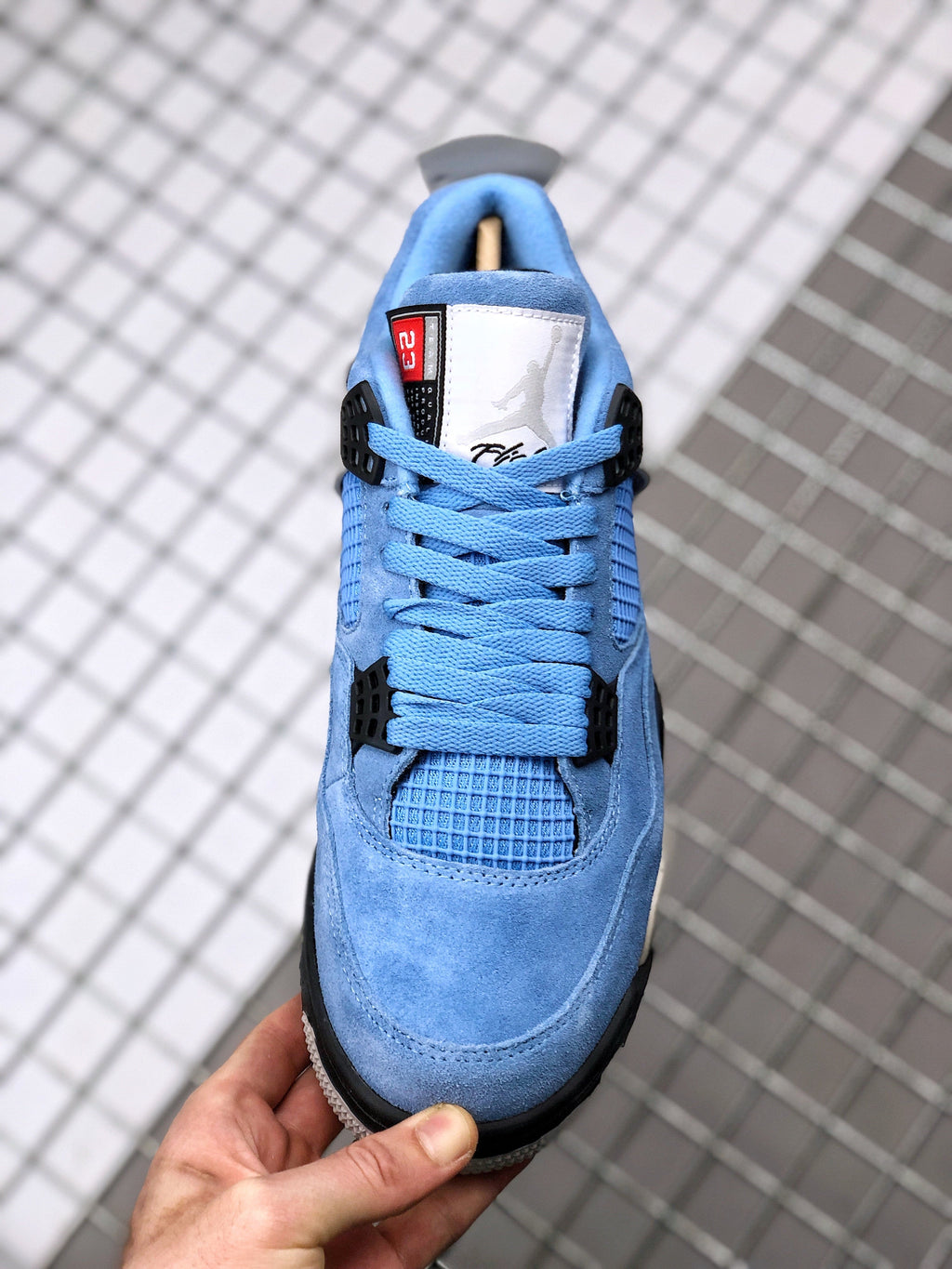 Air Jordan 4 University Blue Sneakers CT8527-400 - product image from the listing.