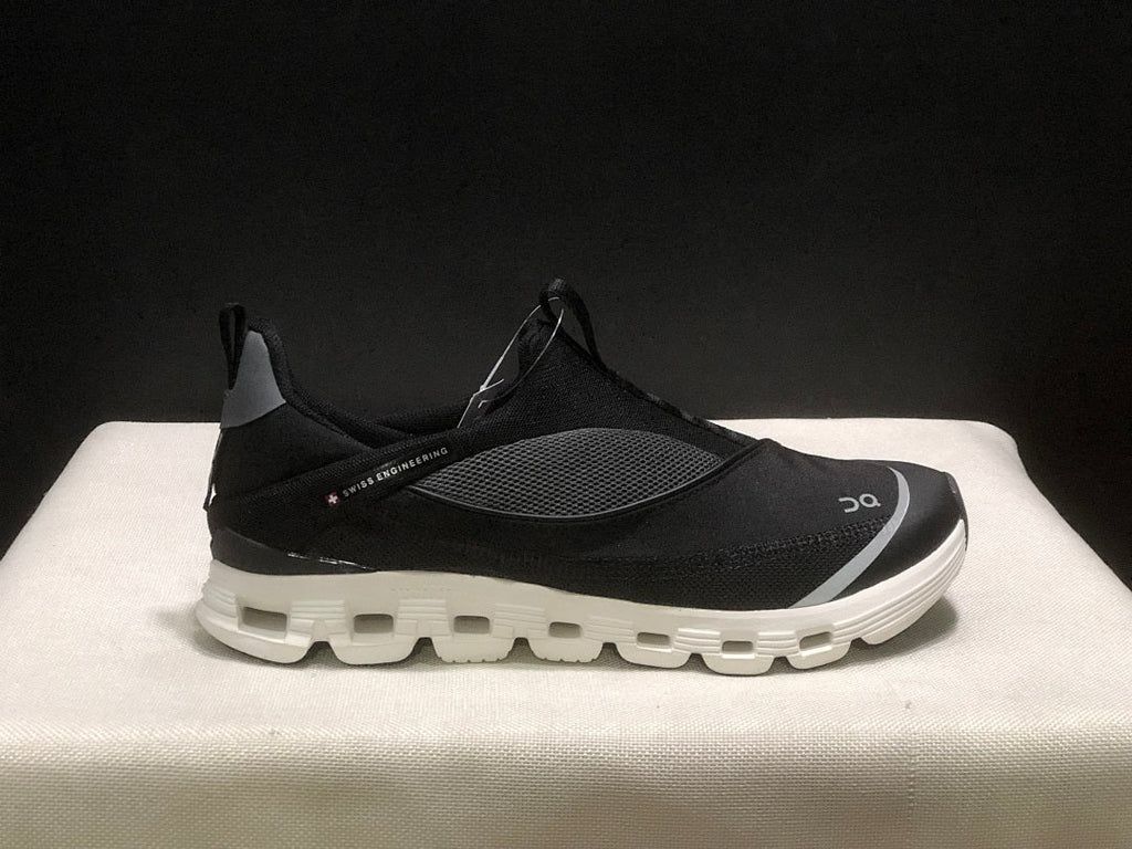 On Cloud X 4 Coast Sneakers in Black and White - product image from the listing.