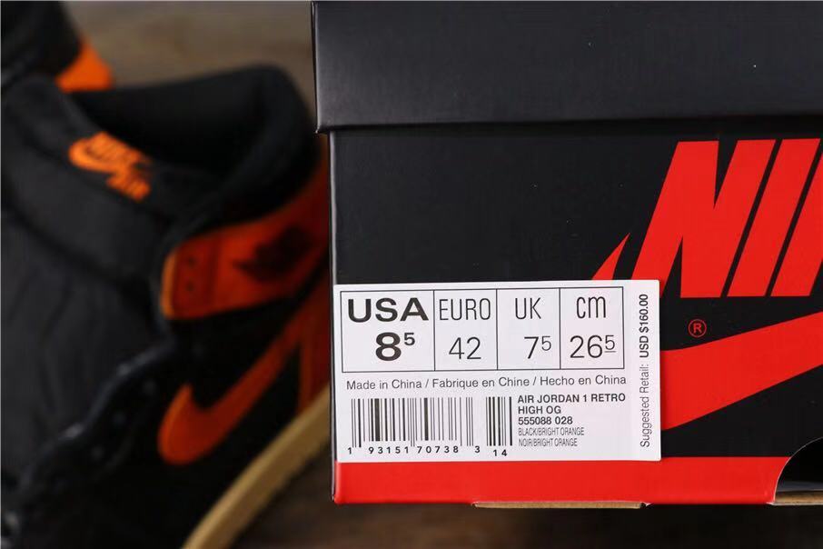 Air Jordan 1 Retro High OG Sneakers in Black and Orange - product image from the listing.
