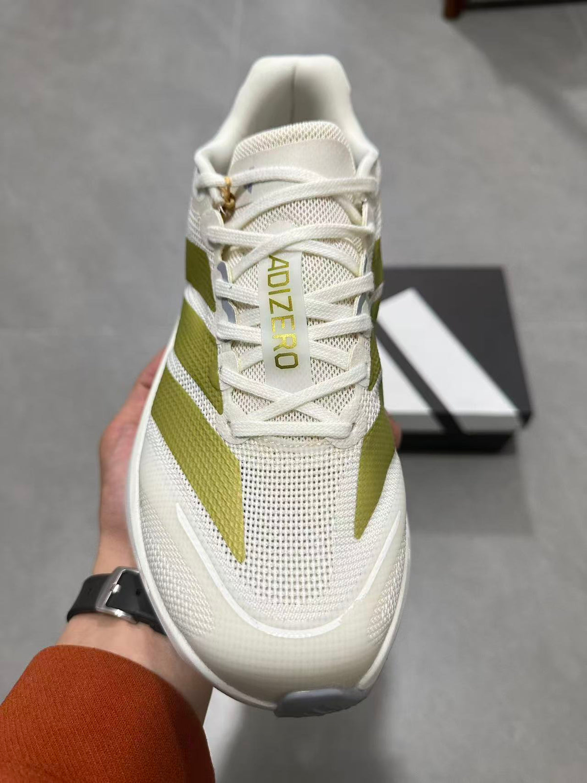 Adizero Lightstrike Pro Running Shoes in White and Olive JS4947 - product image from the listing.