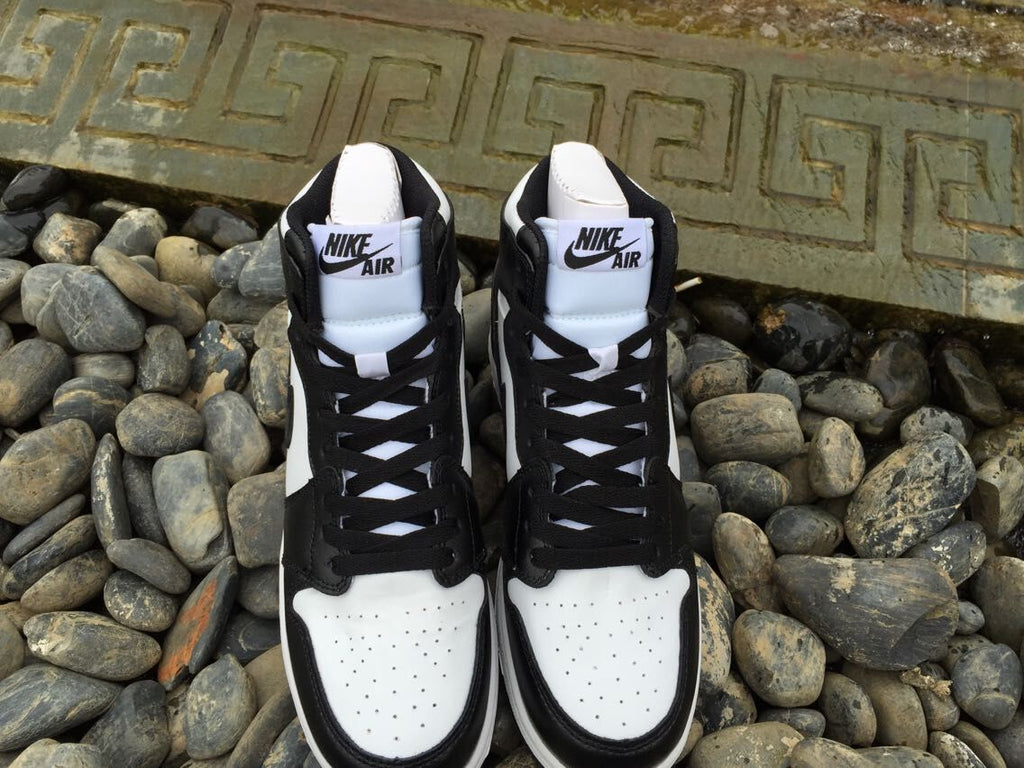 Women's Jordan 1 High Black and White Sneakers - product image from the listing.