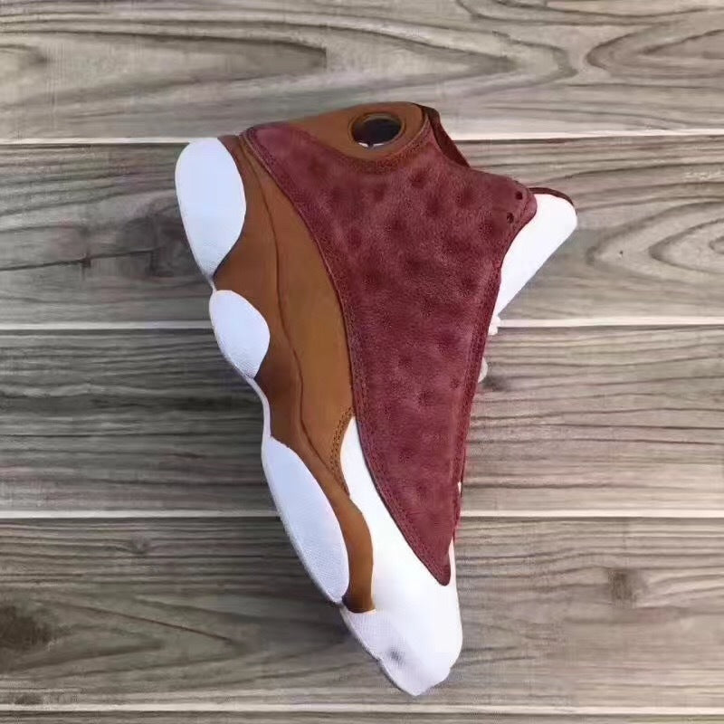Jordan 13 Sneakers in Burgundy Brown White - product image from the listing.