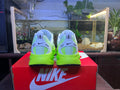 Blue and Volt Green Nike Vomero 18 Running Shoes - product image from the listing.