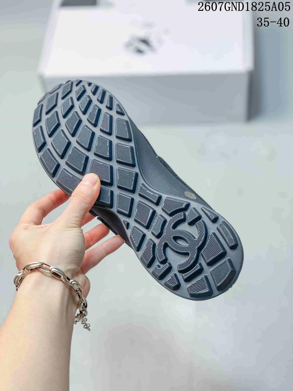 Chanel Low-Top Sneakers in Black and White 2607GND1825A05 - product image from the listing.