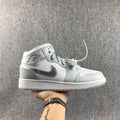 Air Jordan 1 Mid GS White and Silver Sneakers - product image from the listing.