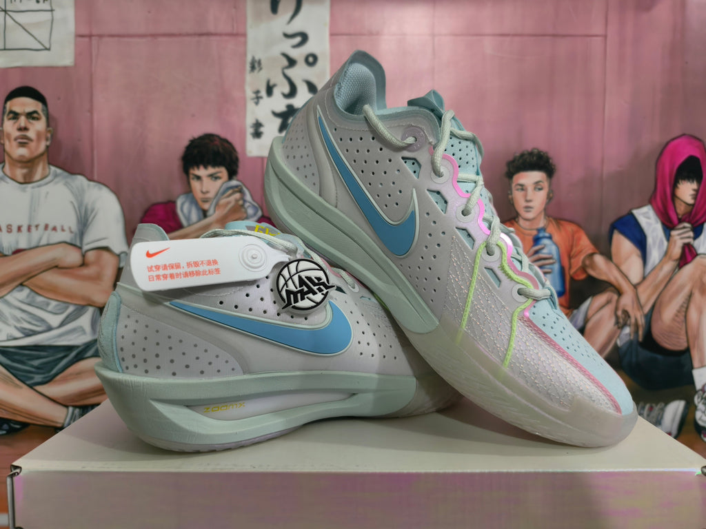 Light Gray and Blue Nike Basketball Shoes - product image from the listing.