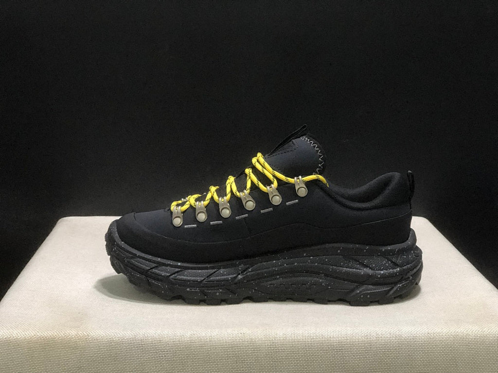 HOKA Tor Summit Trail Sneakers in Black and Yellow - product image from the listing.