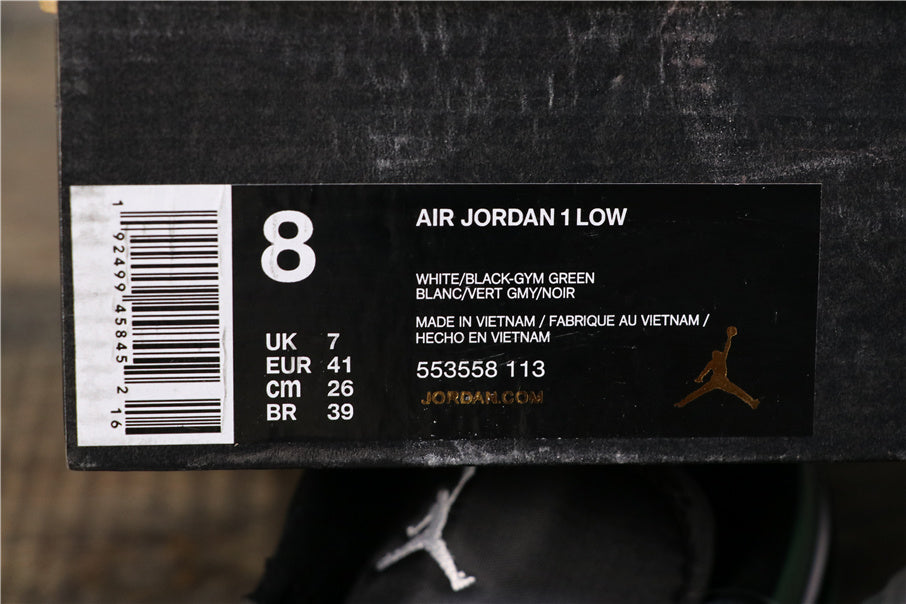 Jordan 1 Low Sneakers in Black Green 553558-113 - product image from the listing.