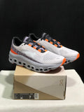 On Cloudmonster Sneakers in Foggy in White and Orange - product image from the listing.