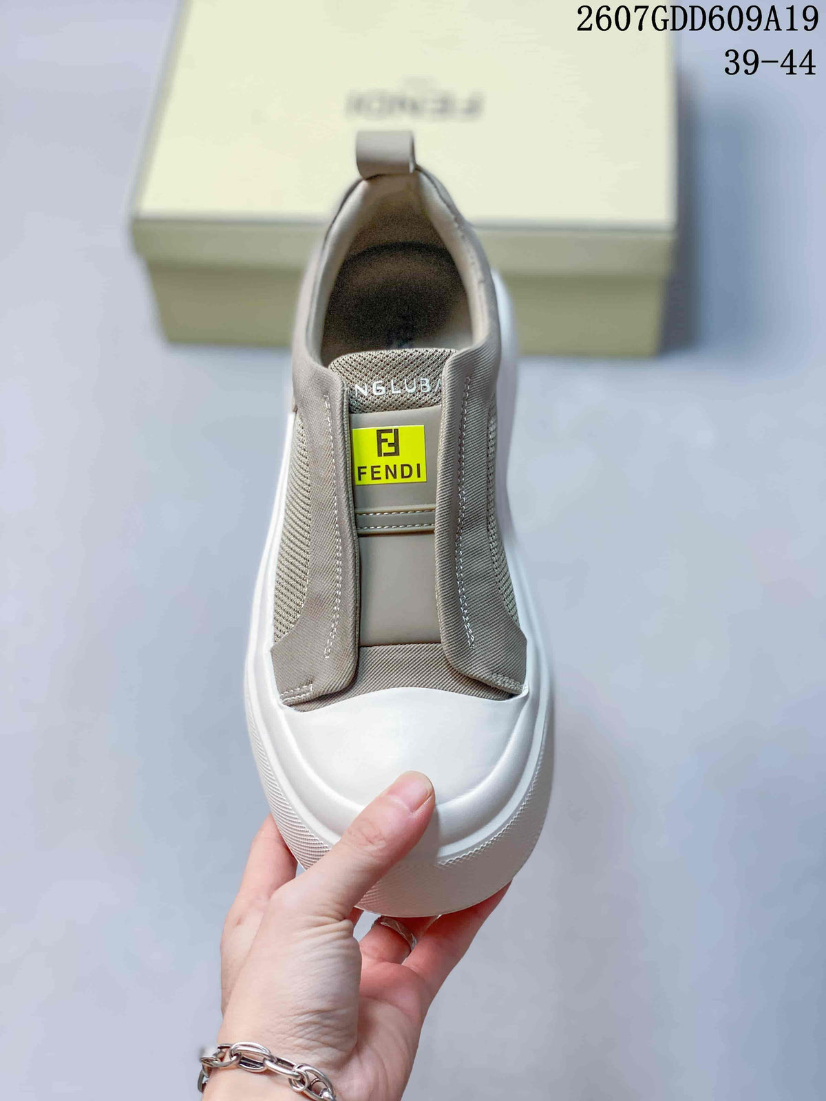 Fendi GDD609A19 Slip-On Sneakers in Taupe and White - product image from the listing.