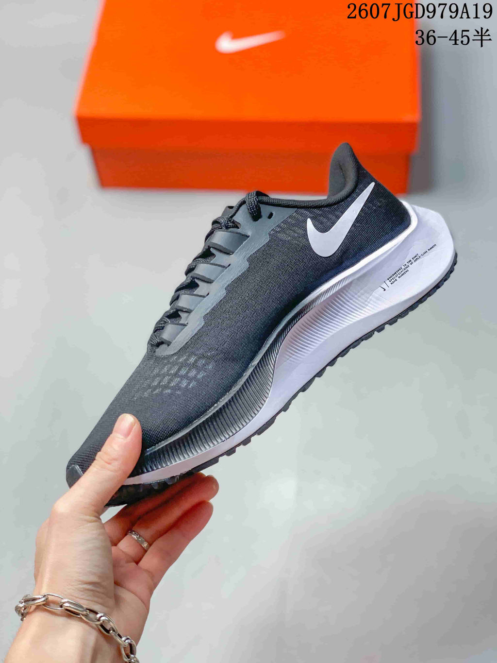 Nike Pegasus 37 Running Sneakers in Black and White - product image from the listing.