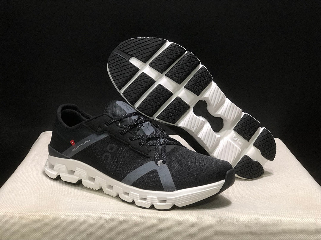 Black and White On Cloud X 4 AD Sneakers - product image from the listing.