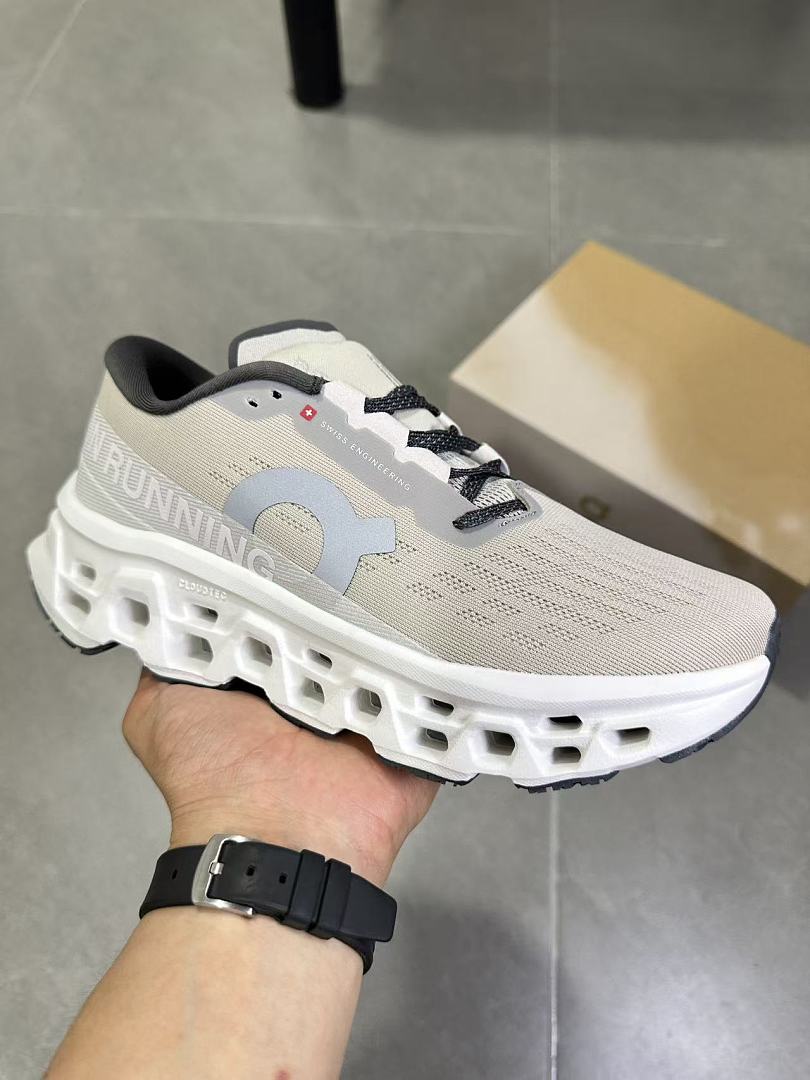 Gray and White On Running Cloudmonster Sneakers - product image from the listing.