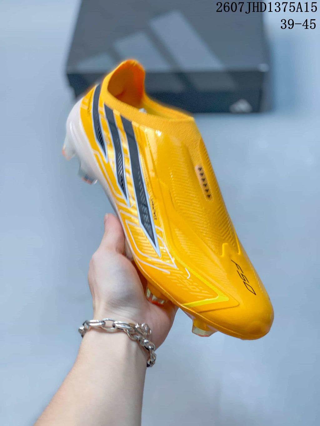 F50 Elite Yellow Black Laceless Soccer Cleats by adidas - product image from the listing.