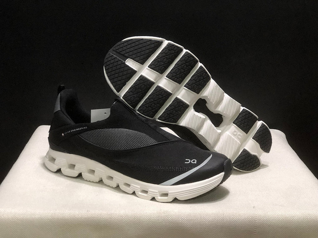 On Cloud X 4 Coast Sneakers in Black and White - product image from the listing.