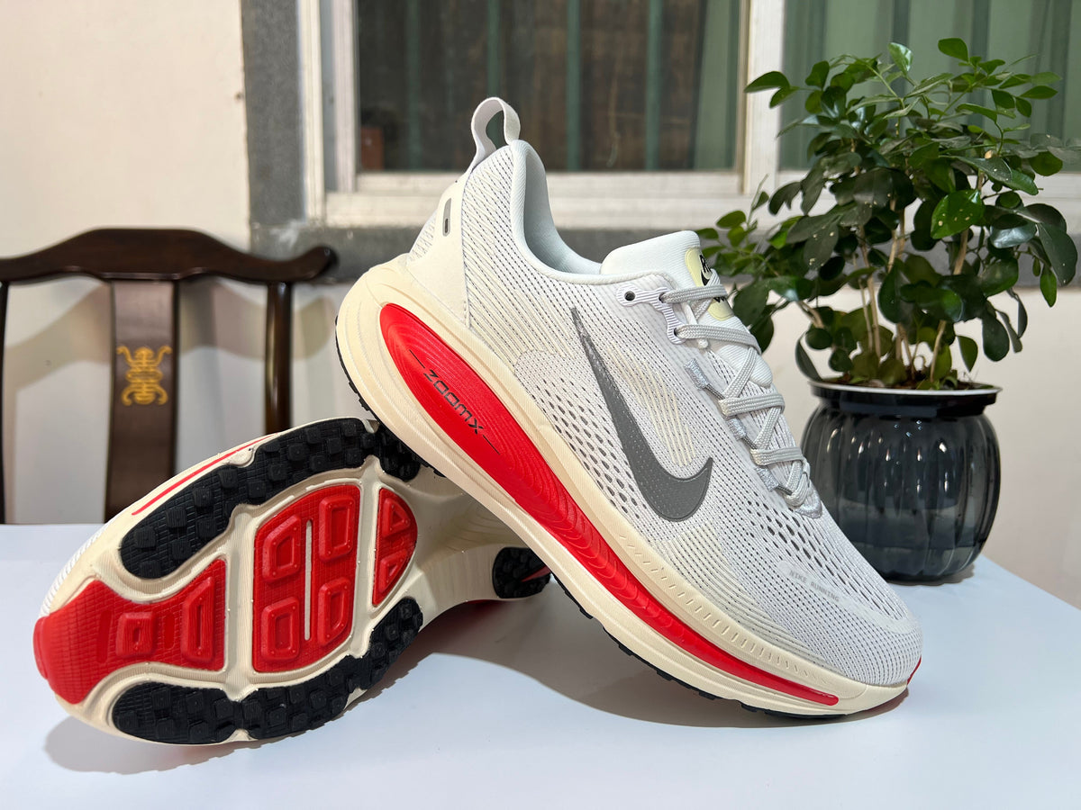 Nike Vomero 18 Running Shoes in White and Red - product image from the listing.