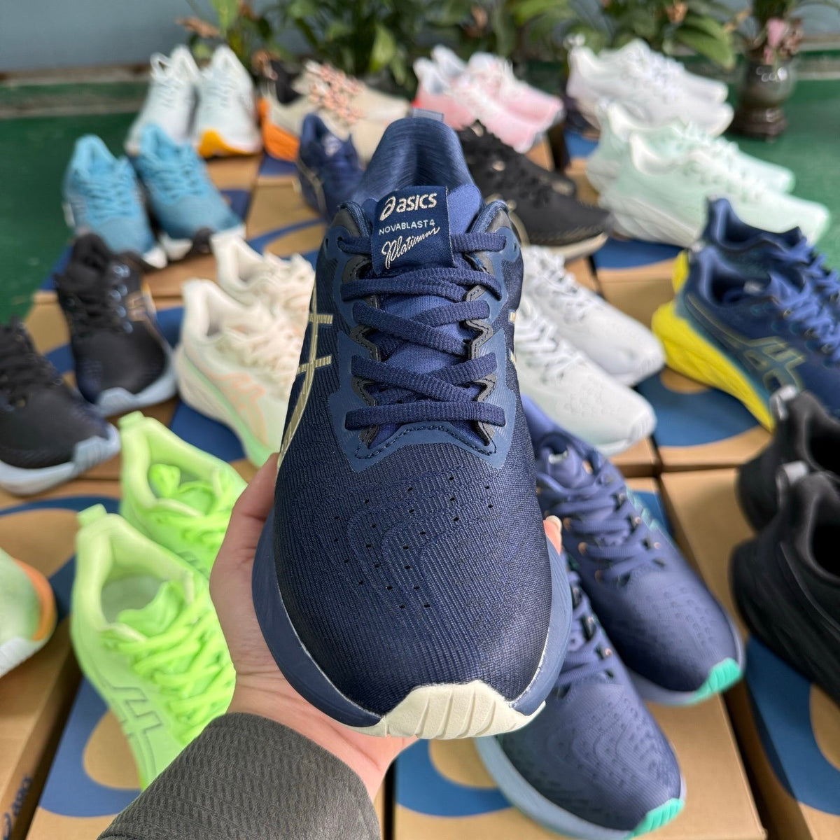 ASICS NOVABLAST 4 Running Shoes, in Blue and Gold - product image from the listing.