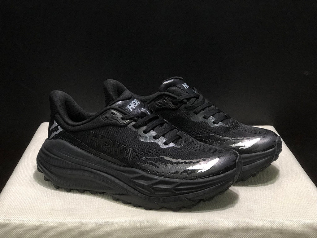 HOKA Stinson 7 Black Trail Trainers - product image from the listing.