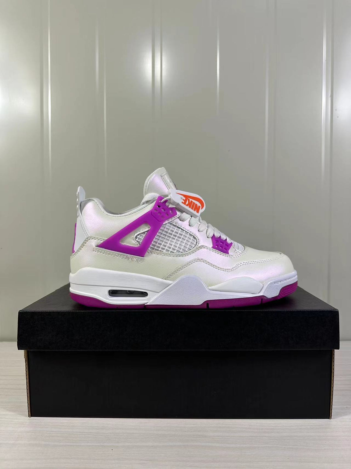 Air Jordan 4 Retro Hyper Violet Sneakers FQ1314-151 - product image from the listing.