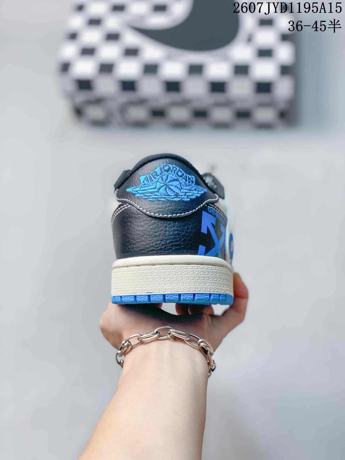 Air Jordan 1 Low White Black Blue Sneakers 2607JYD1195A15 - product image from the listing.