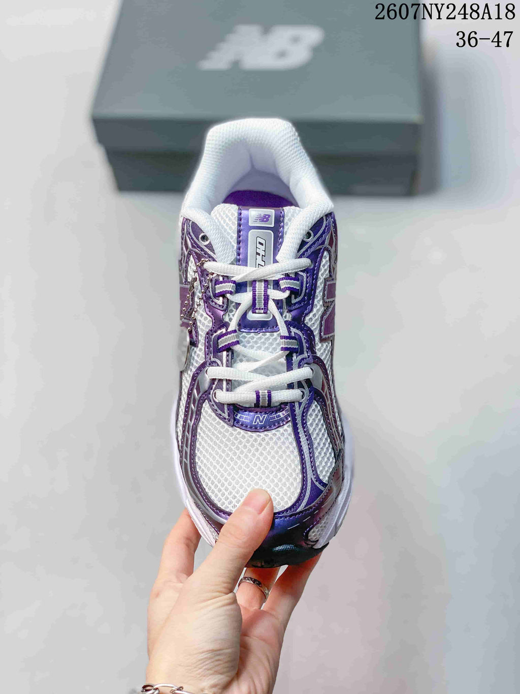 New Balance 740 Sneakers in White and Purple - product image from the listing.
