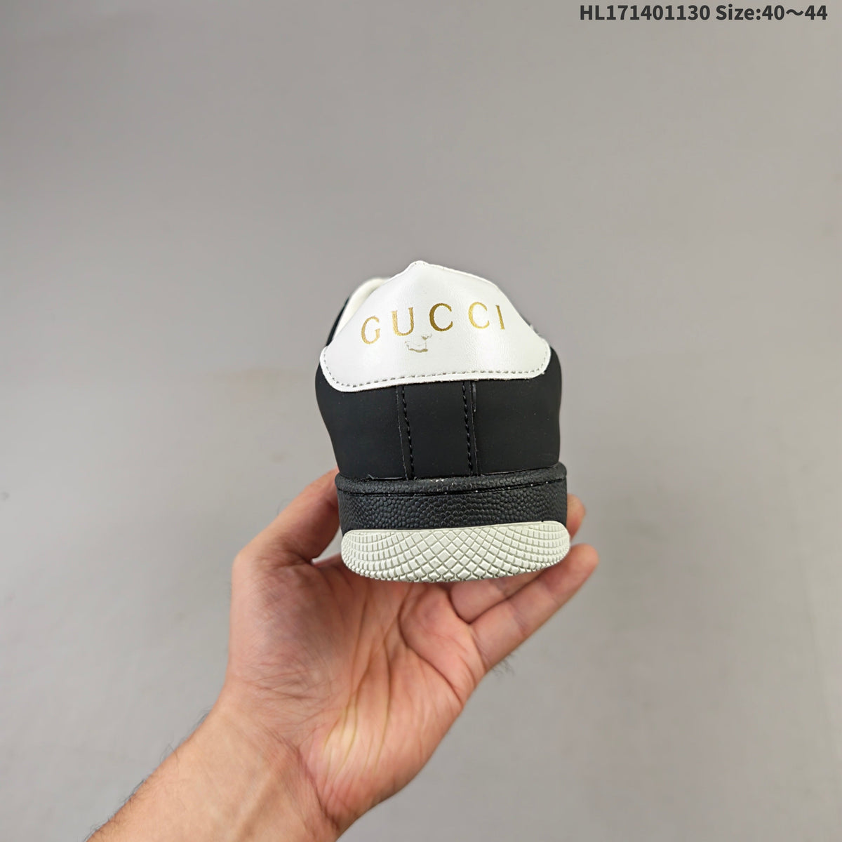 Gucci Screener Distressed Low-Top Sneakers in Black and White HL171401130 - product image from the listing.