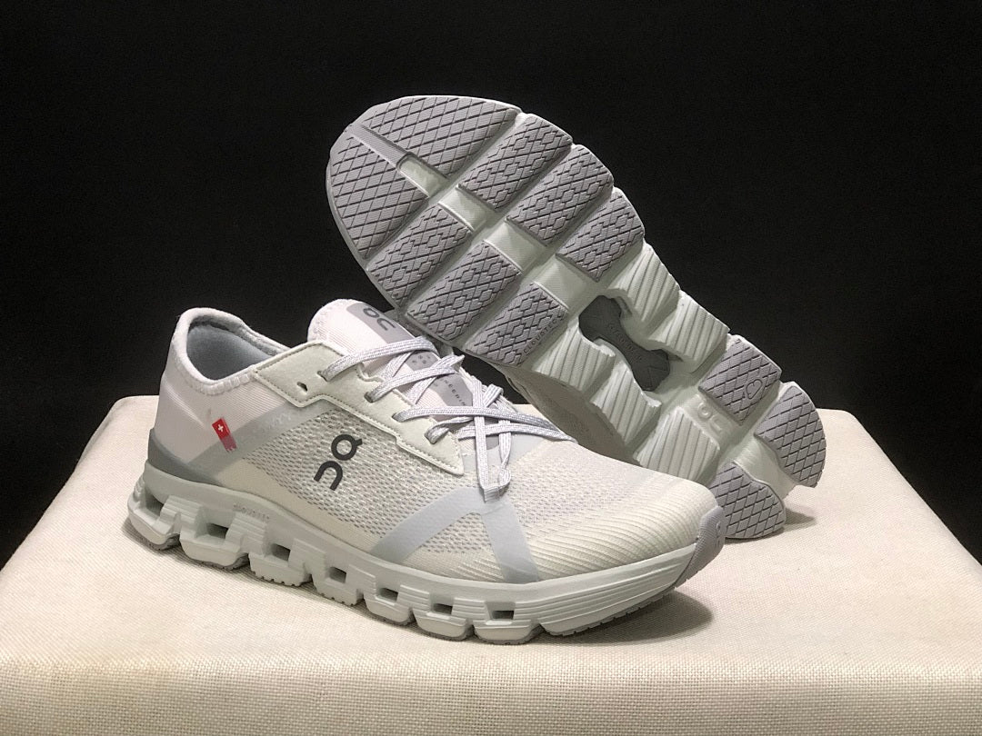 On Cloud X 4 AD Sneakers in Wolf/Alloy in Light Gray - product image from the listing.