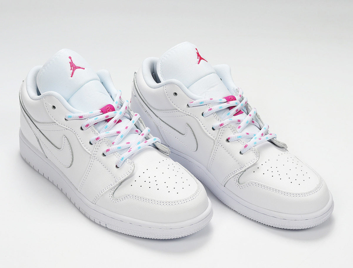 Air Jordan 1 Low White and Pink Sneakers - product image from the listing.