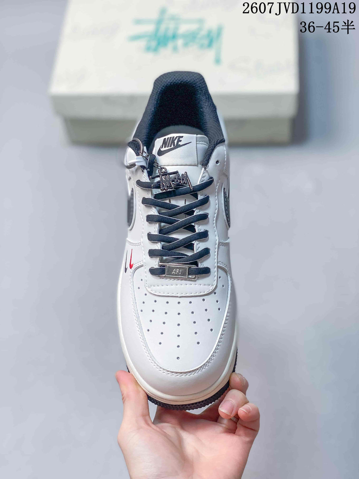 Nike Air Force 1 Low in White Black 2607JVD1199A19 - product image from the listing.