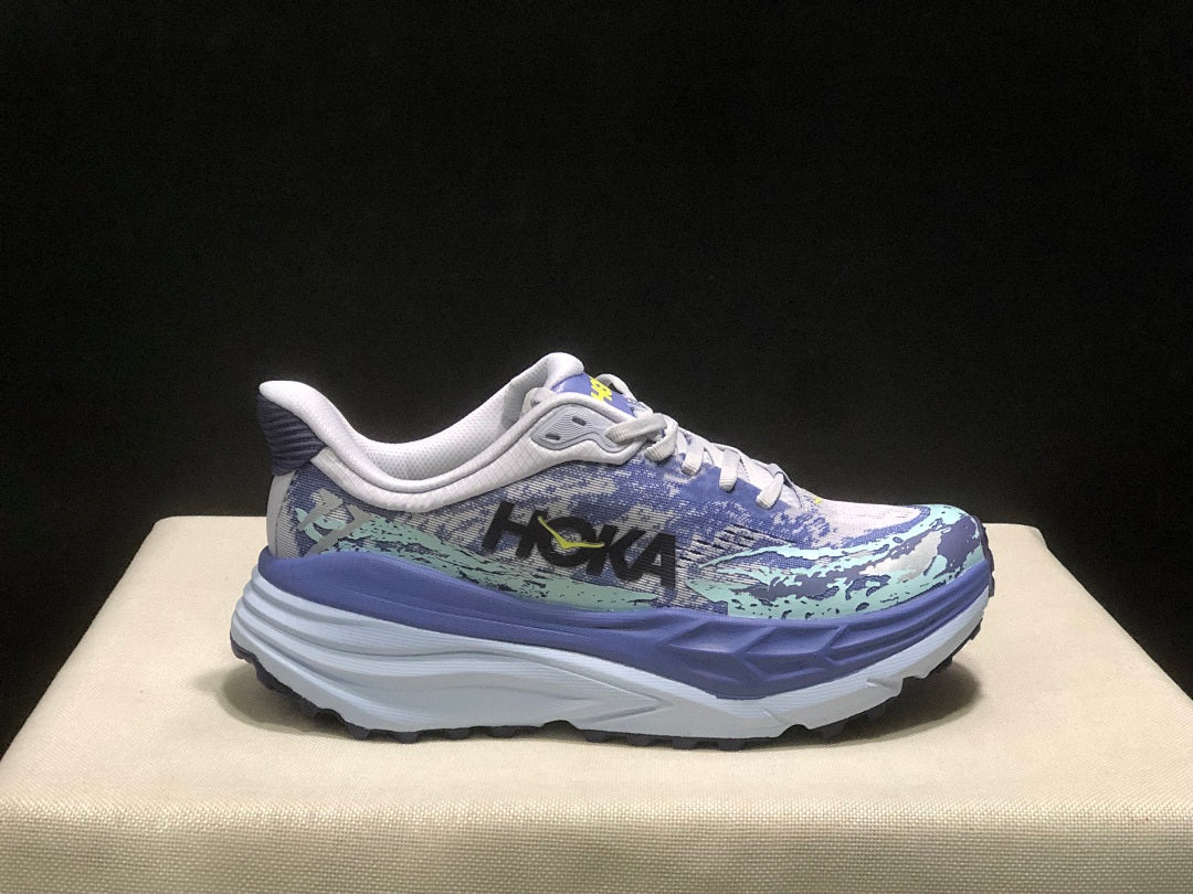 Purple and Mint HOKA Stinson 7 Running Shoes - product image from the listing.