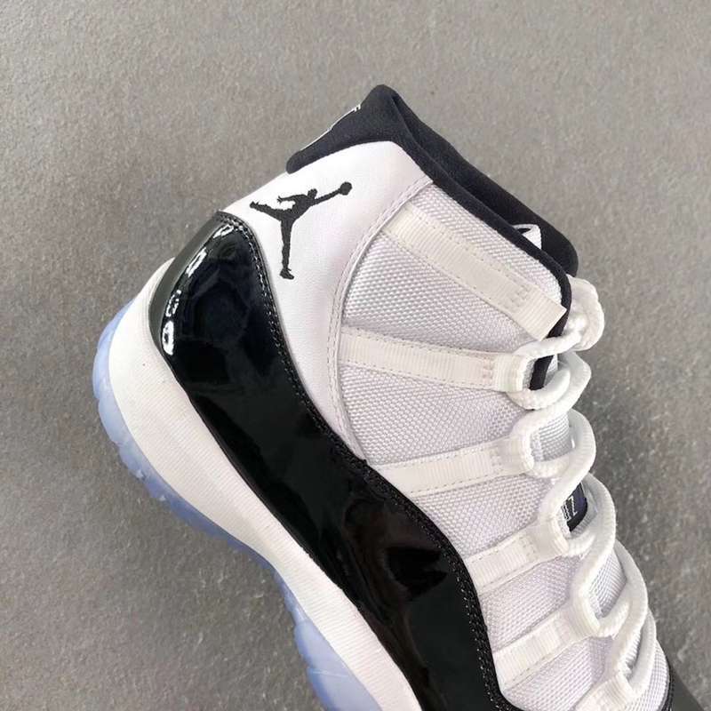 Air Jordan 11 Concord Black White Sneakers - product image from the listing.