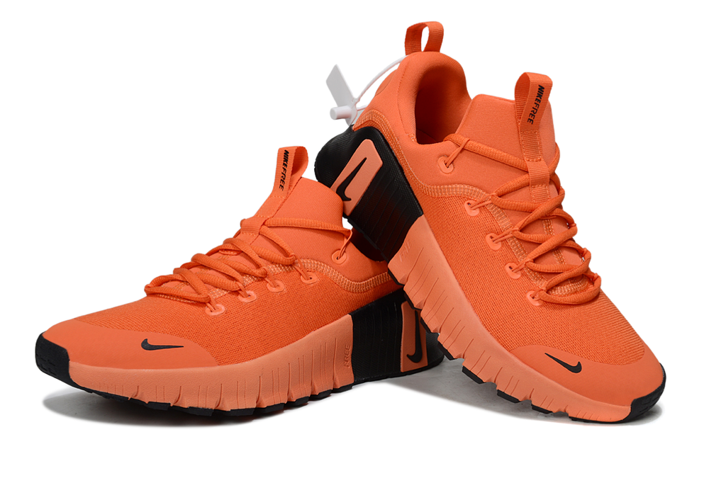 Orange and Black Nike Free Sneakers - product image from the listing.