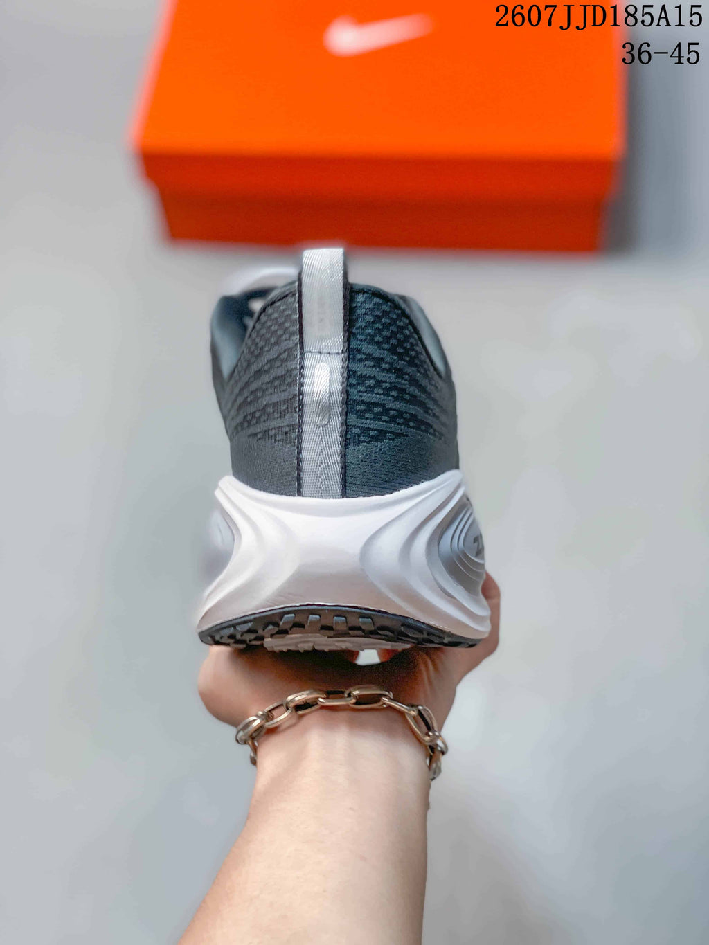 Nike Vomero Plus Run Sneakers in Dark Gray White 2607JJD185A15 - product image from the listing.