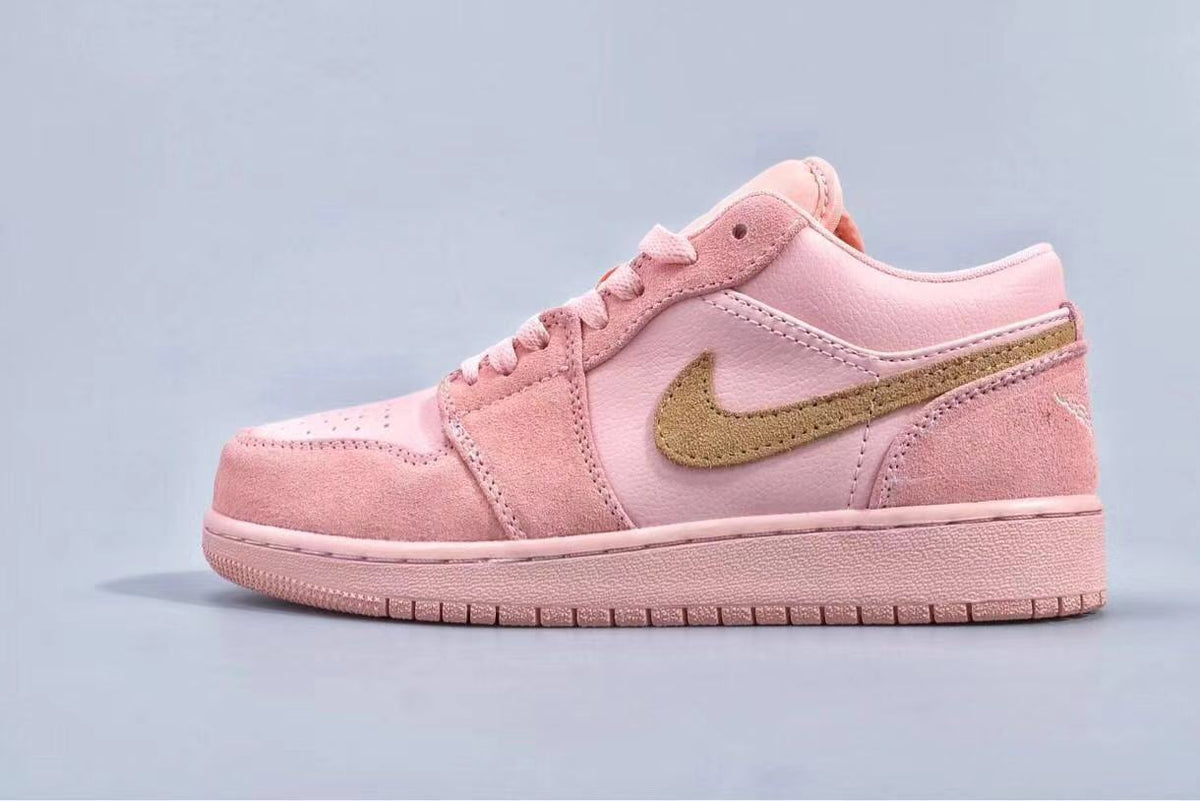 Women's Jordan 1 Low Pink and Gold Sneakers - product image from the listing.
