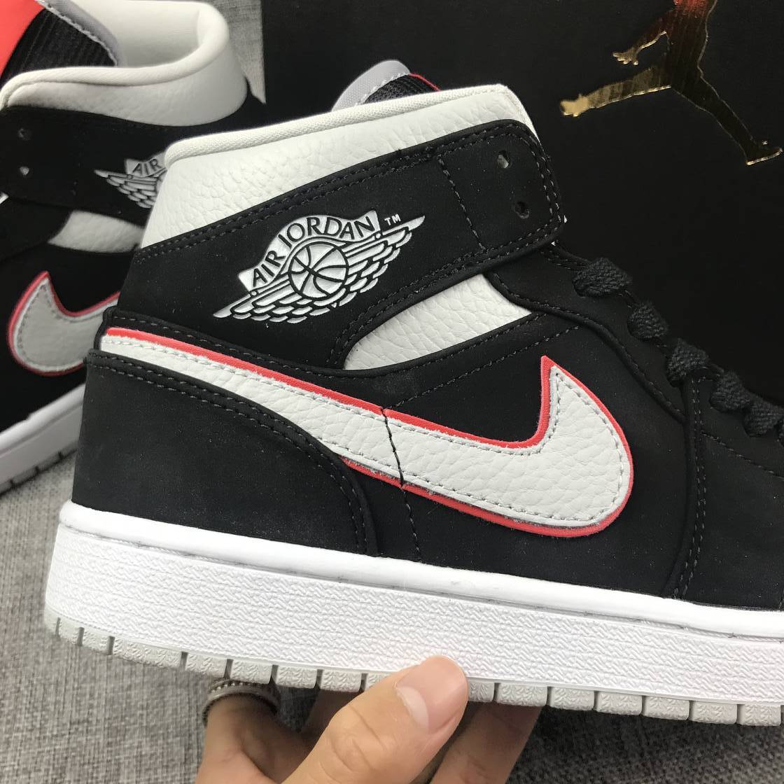 Air Jordan 1 Mid Black, Sneakers in White & Red 554724-060 - product image from the listing.